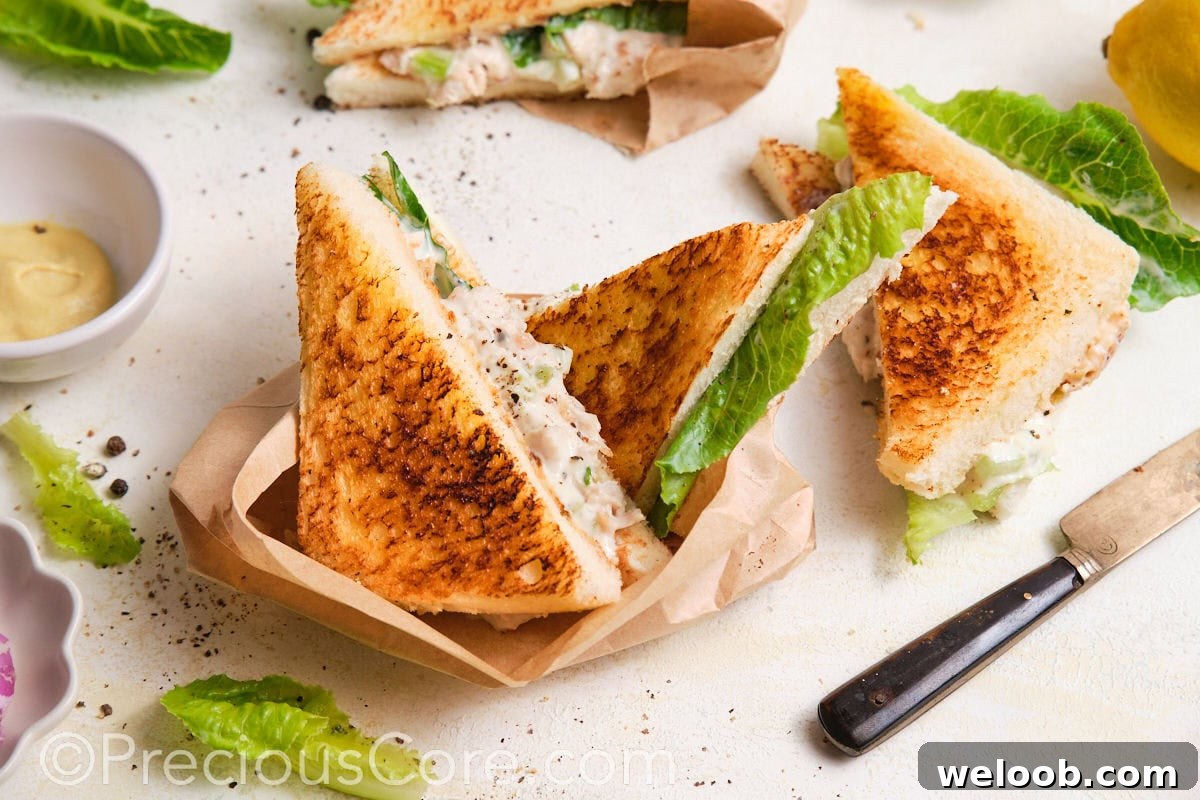 Served sandwiches wrapped in parchment paper.