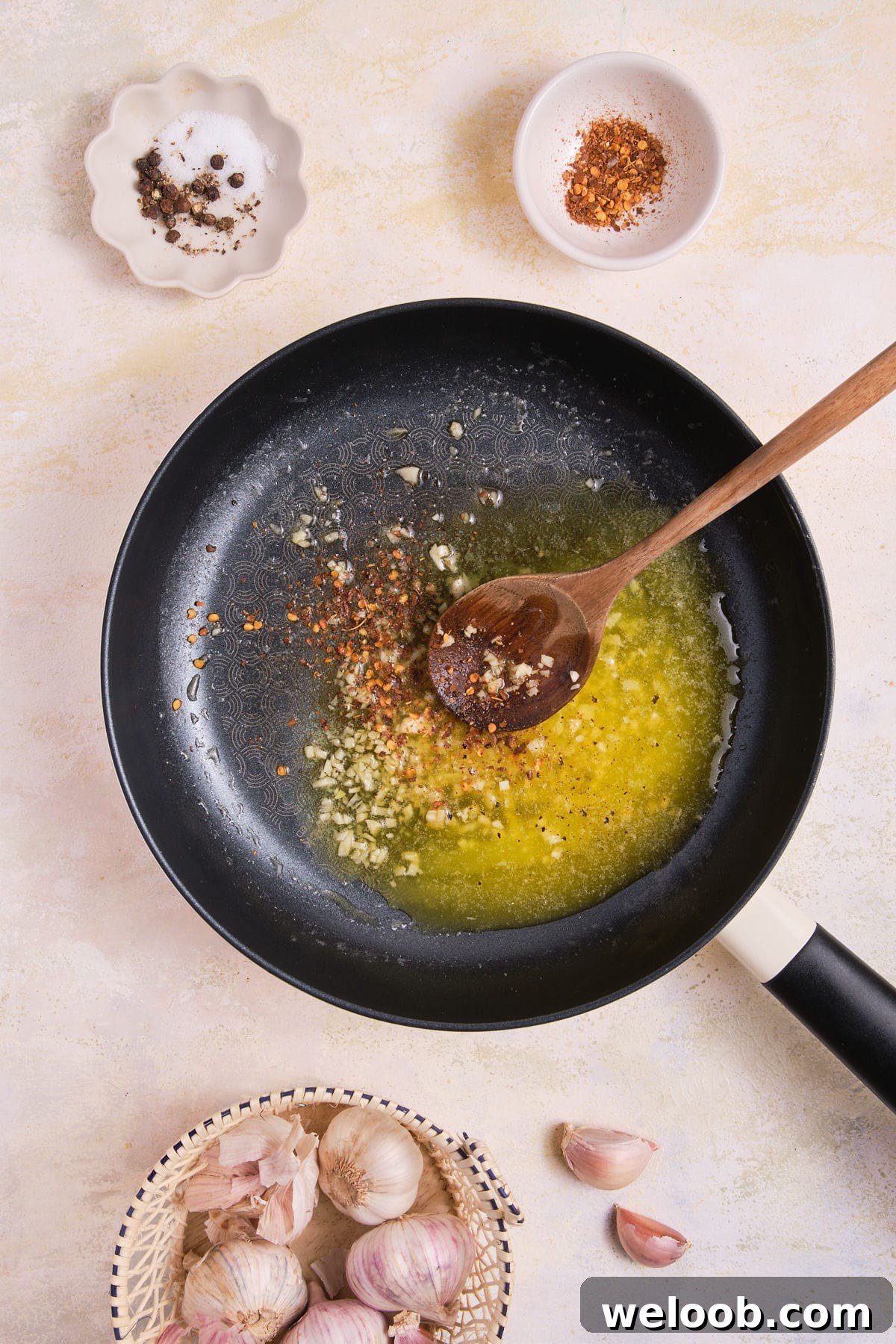 Cooking garlic in melted butter.