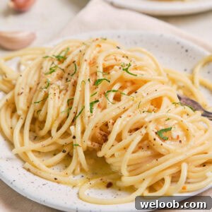Lemon Garlic Butter Pasta on a speckled plate.