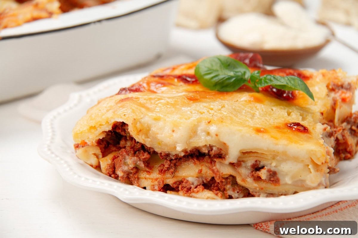 Close-up of a slice of lasagna made with béchamel sauce.