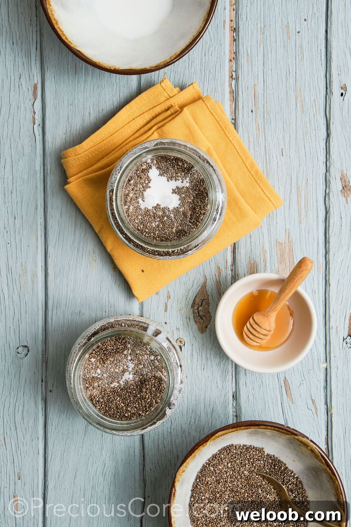 Milk and other ingredients added to glass jar.