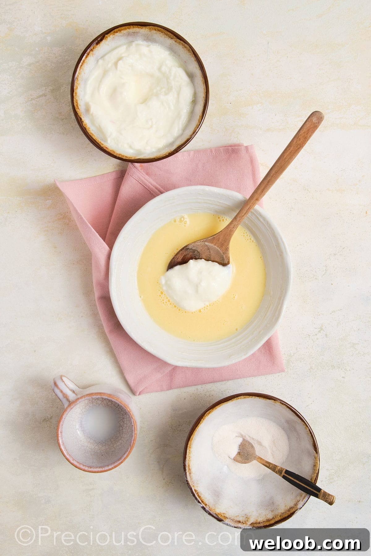 Greek yogurt being added to pudding mix.
