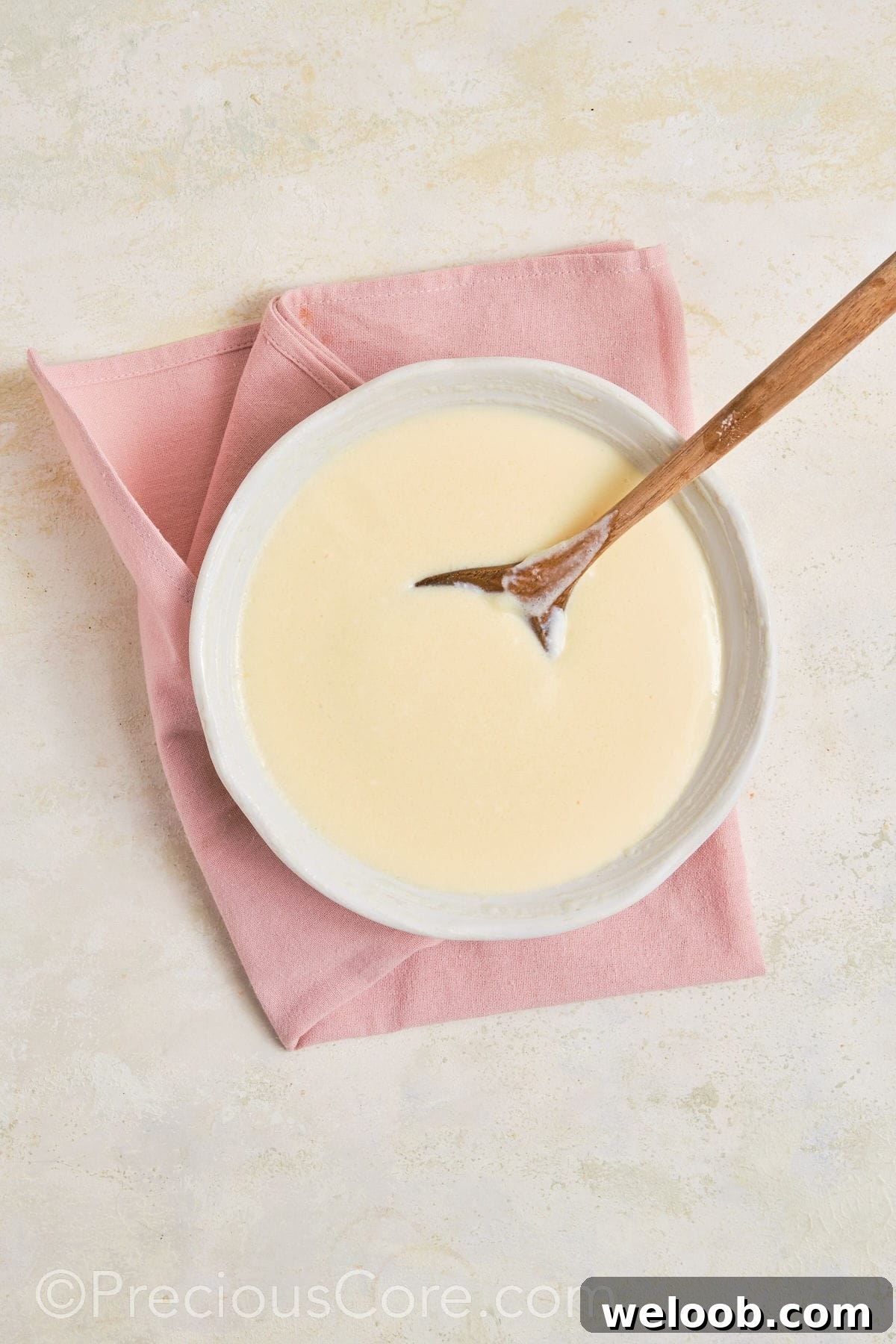 Mixing banana pudding mix.