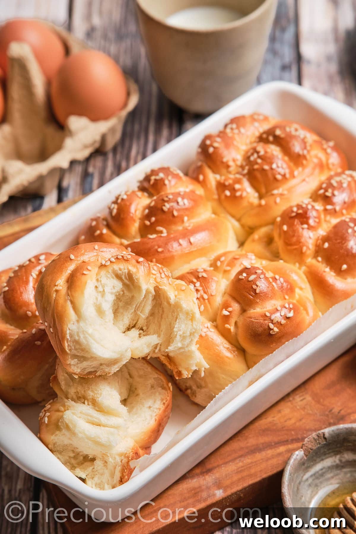 Challah roll cut in half to show texture.