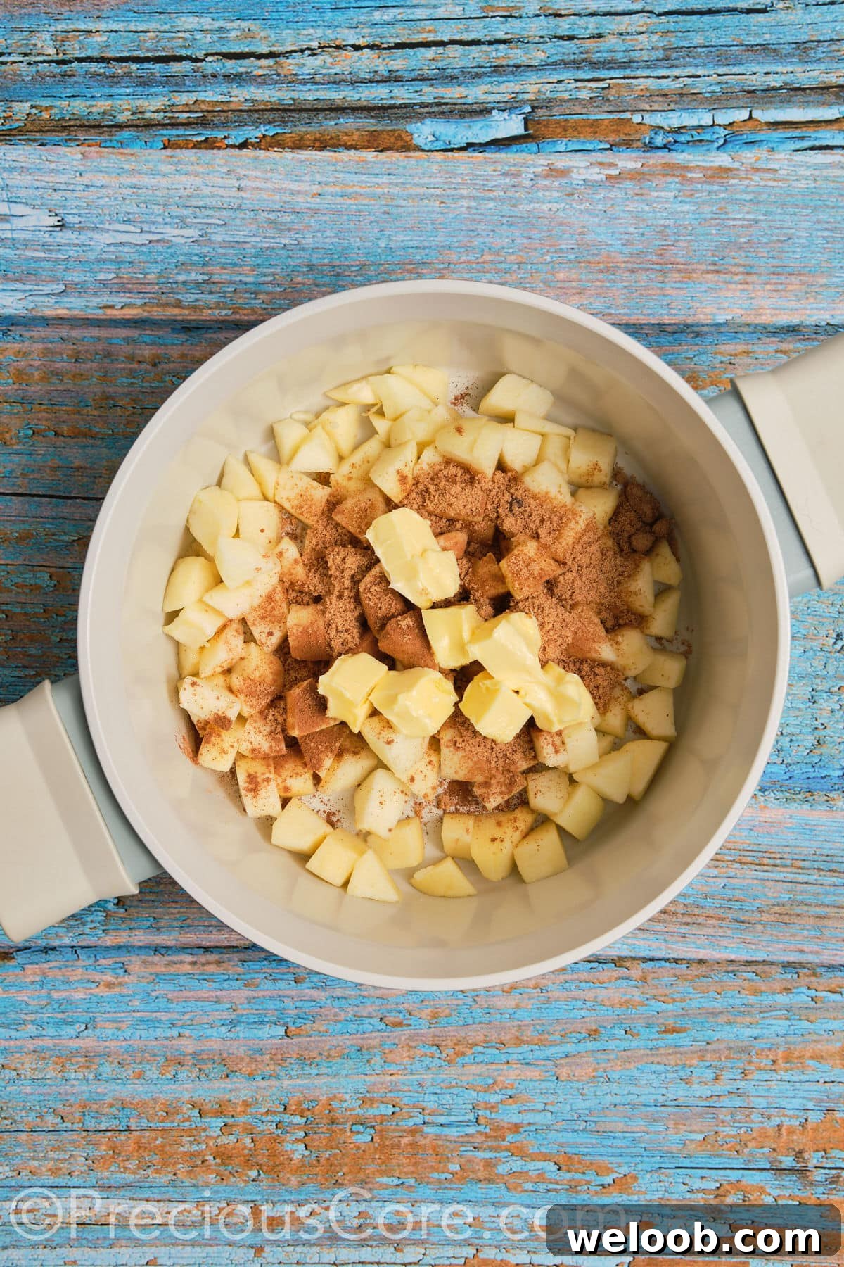 Ingredients for apple pie filling in a pot.
