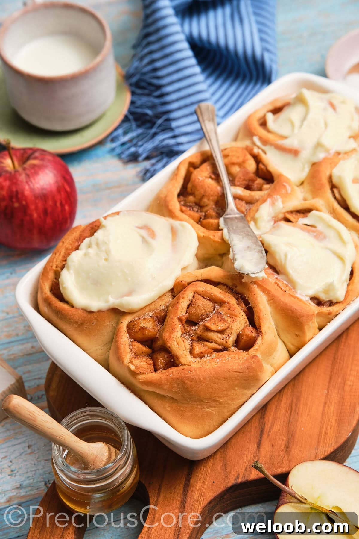 Side shot of homemade apple cinnamon rolls.