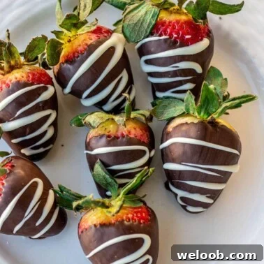 Chocolate dipped strawberries on a plate
