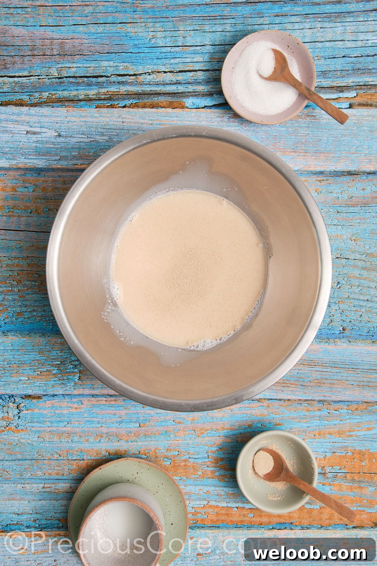 Proofing yeast in a mixing bowl.