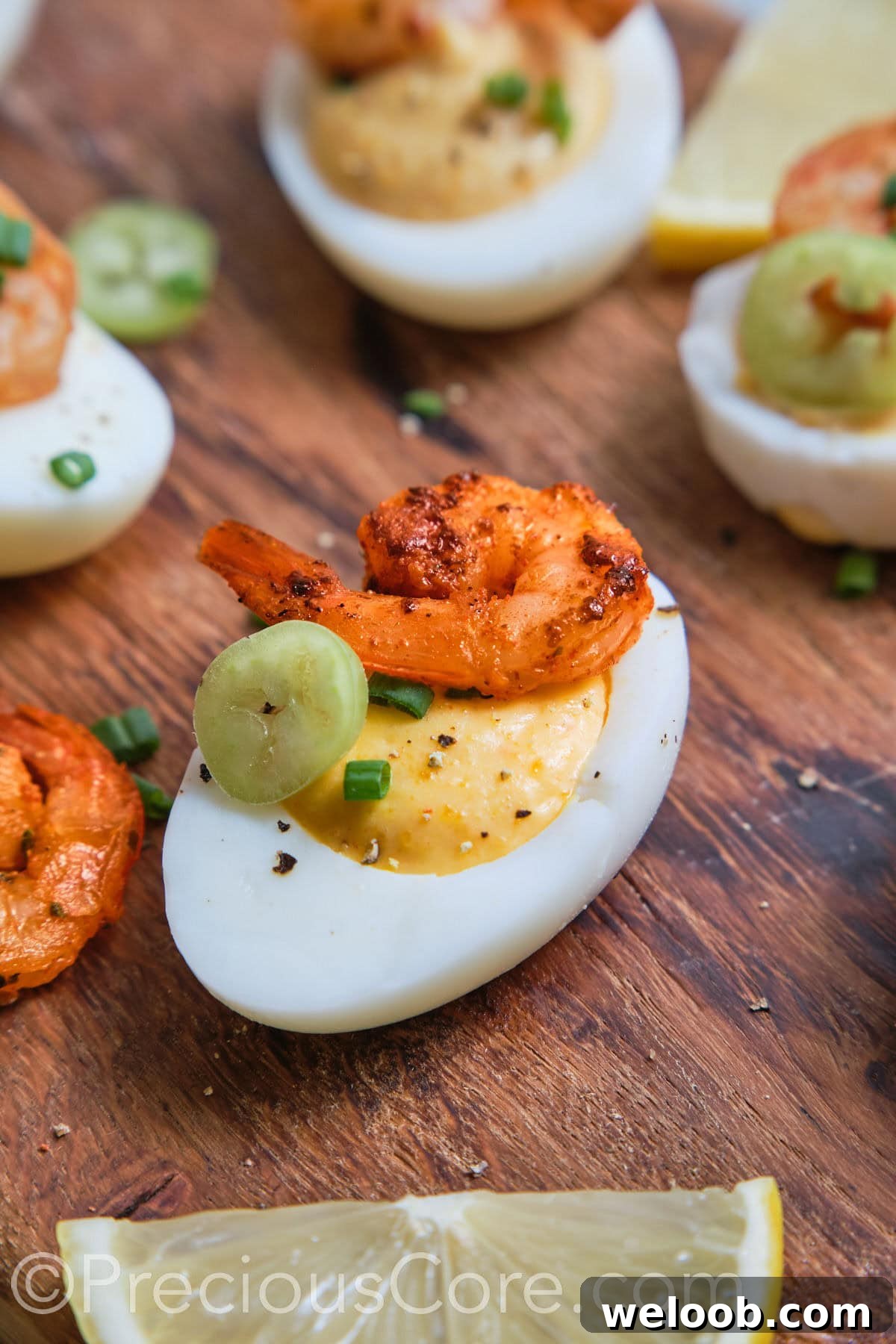 Deviled Egg close up with shrimp and jalapeno.