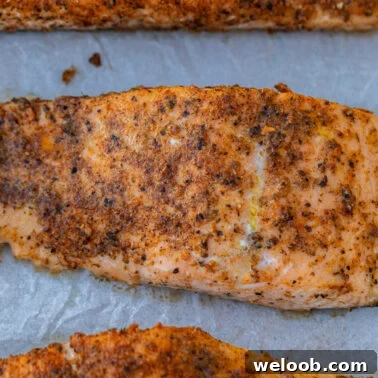 Square image of baked salmon.