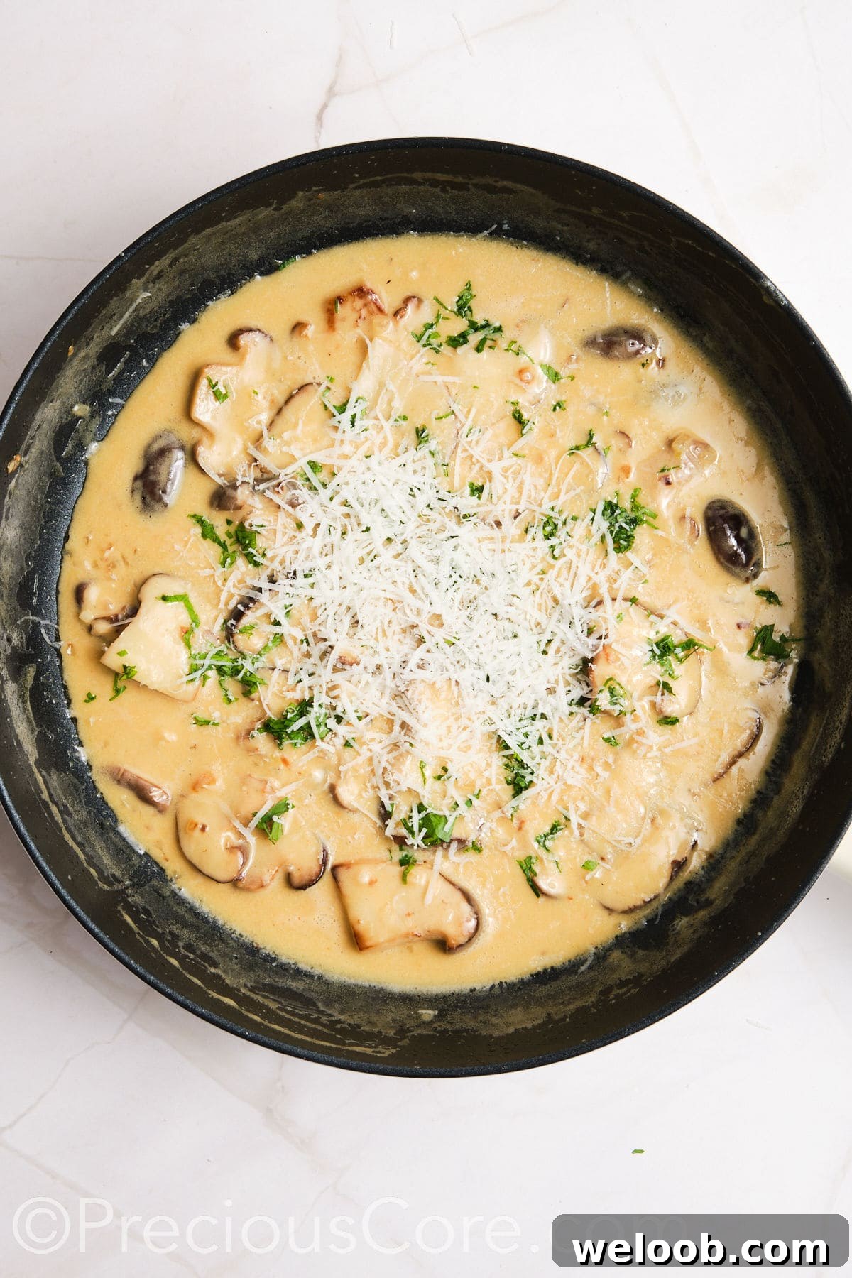 Parmesan added to creamy mushroom sauce.