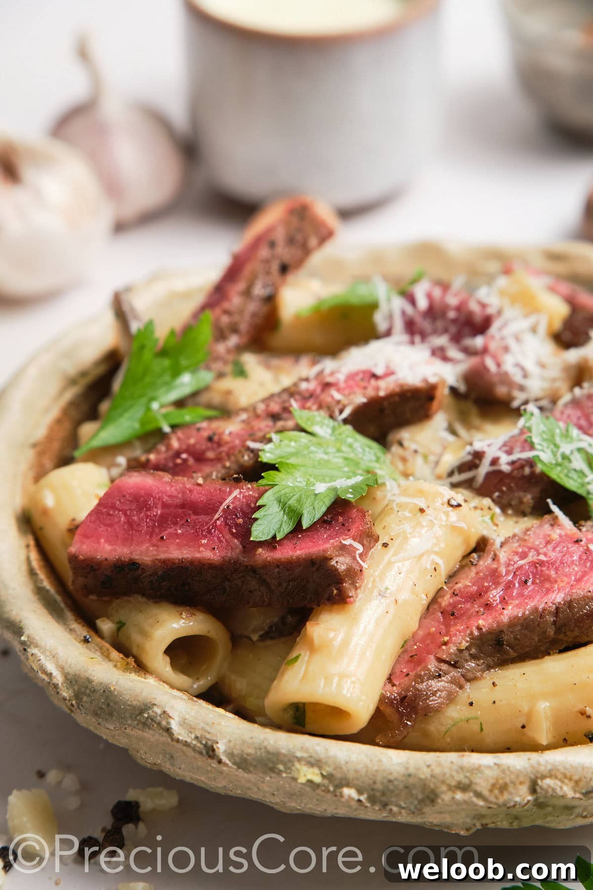 Close-up shot of steak and pasta.