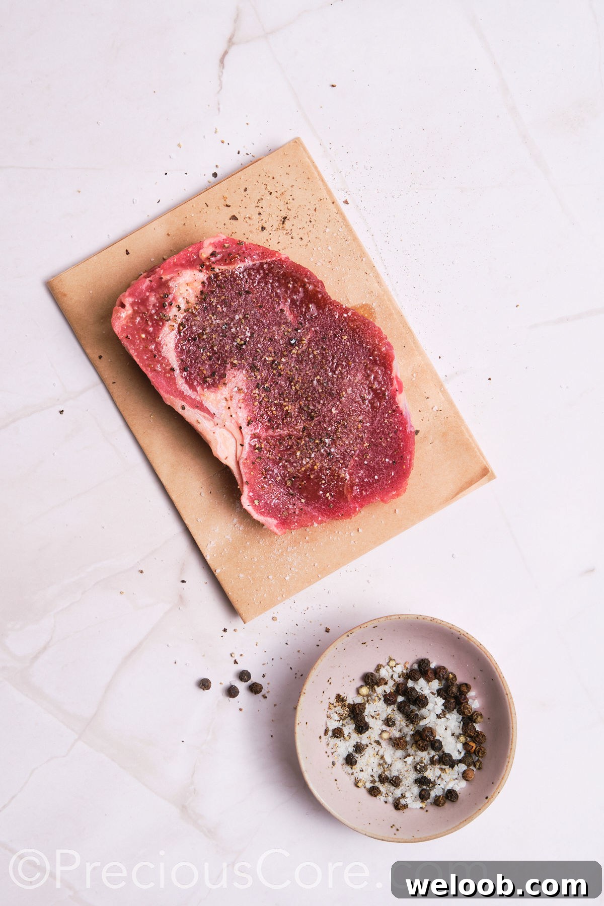 Steak seasoned with salt and pepper.