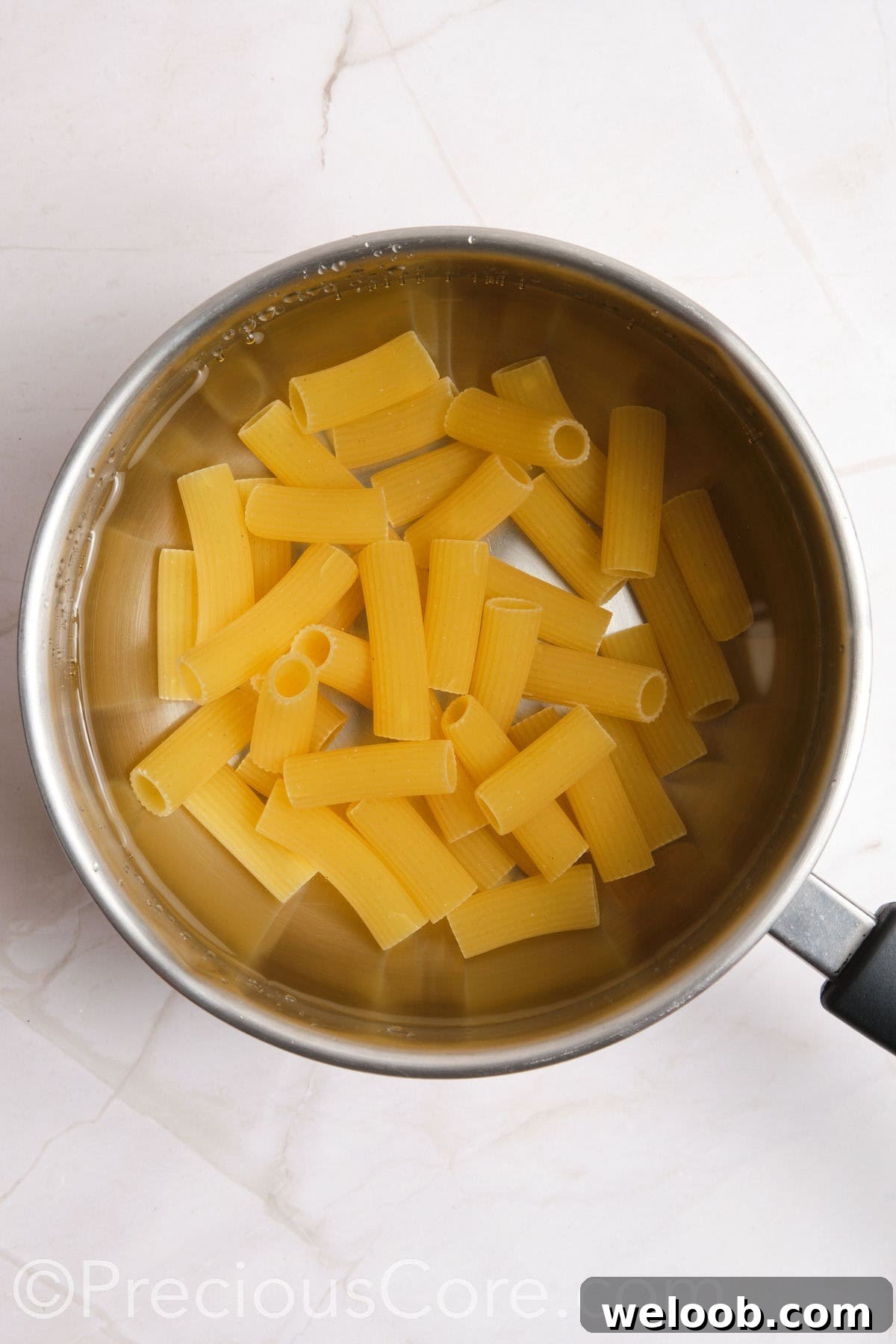 Pasta boiling in a pot of water.