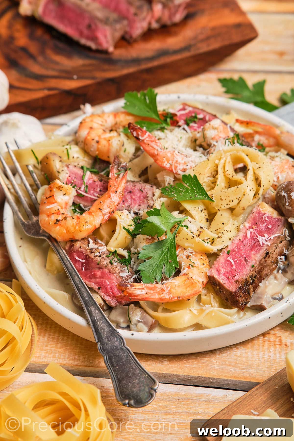 Tagliatelle pasta dinner topped with black pepper and parmesan.