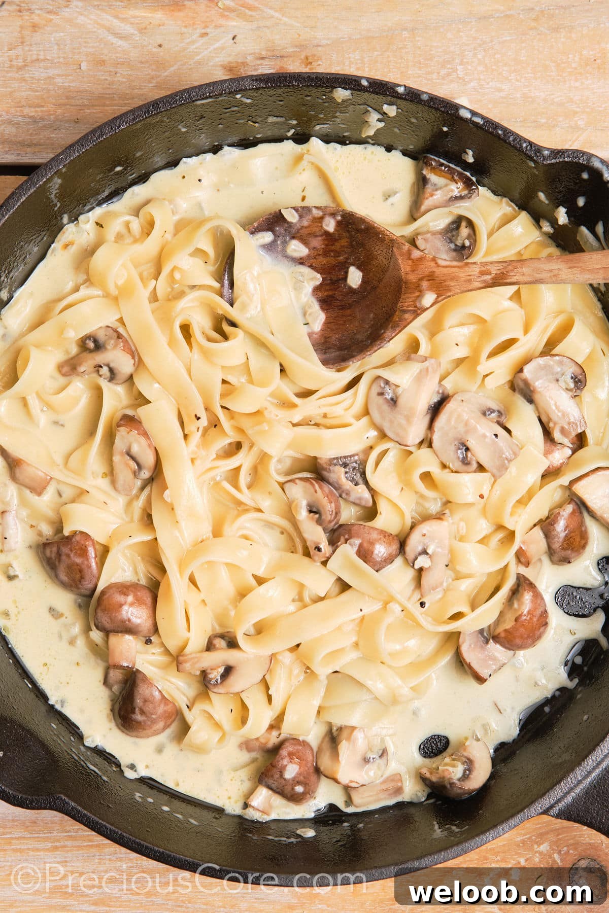 Creamy tagliatelle pasta in a pan.