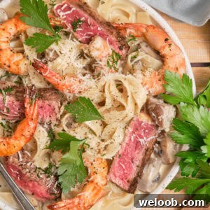 Creamy pasta topped with juicy steak and shrimp.