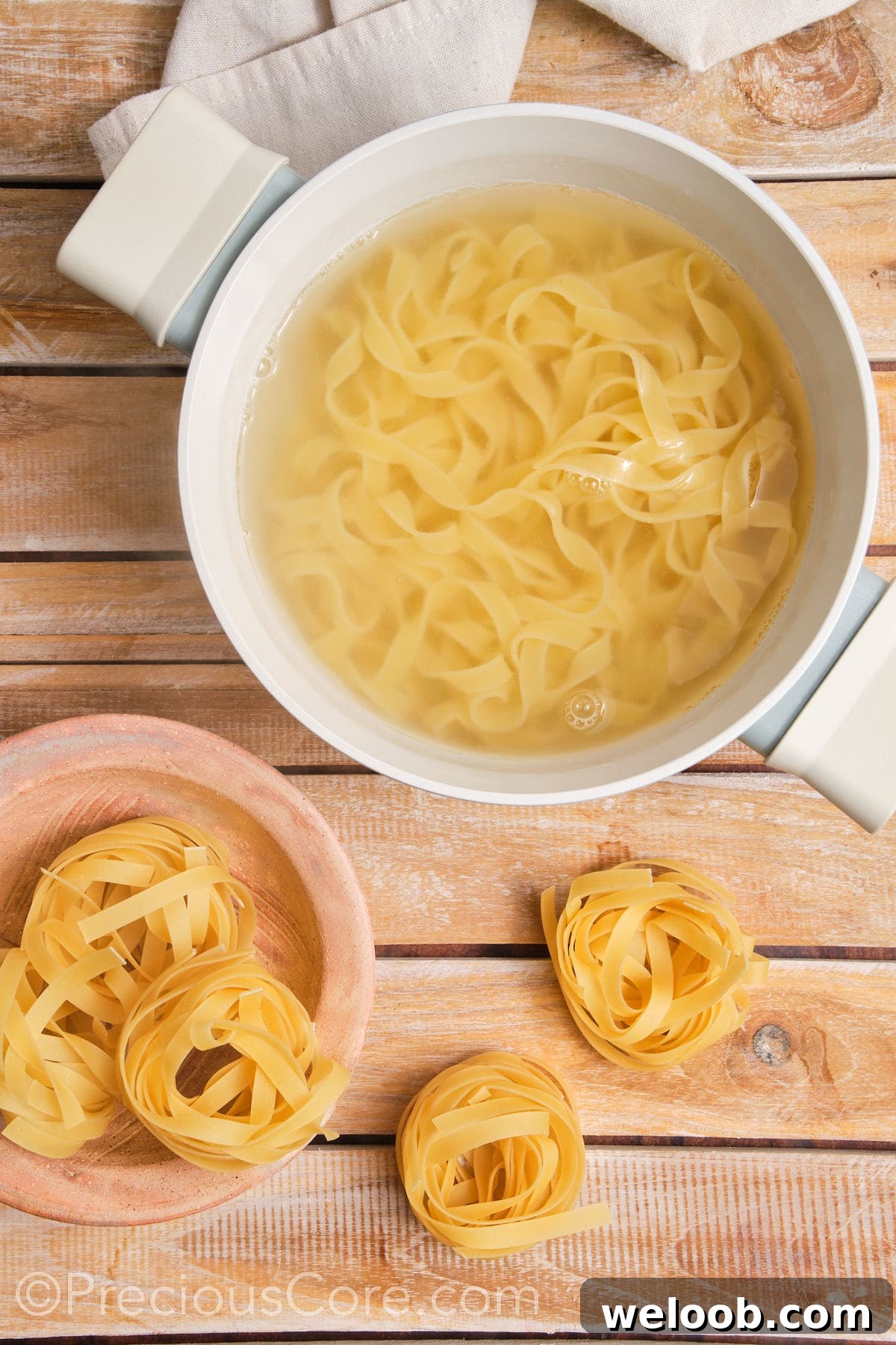 Pasta cooking in a pot of water.
