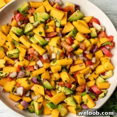 A square image of mango avocado salsa.