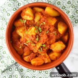 Patate Rifatte (redone potatoes) are a great potato side dish made from leftover boiled potatoes, fried with garlic and herbs and cooked in a delicious tomato sauce. www.insidetherustickitchen.com