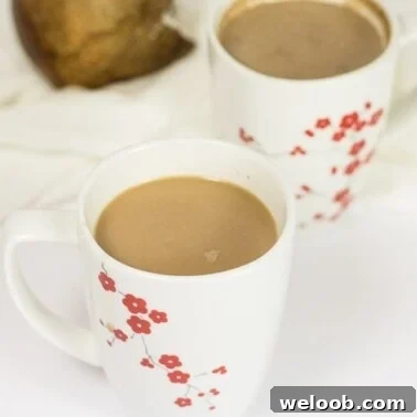 Two mugs of coconut hot chocolate.