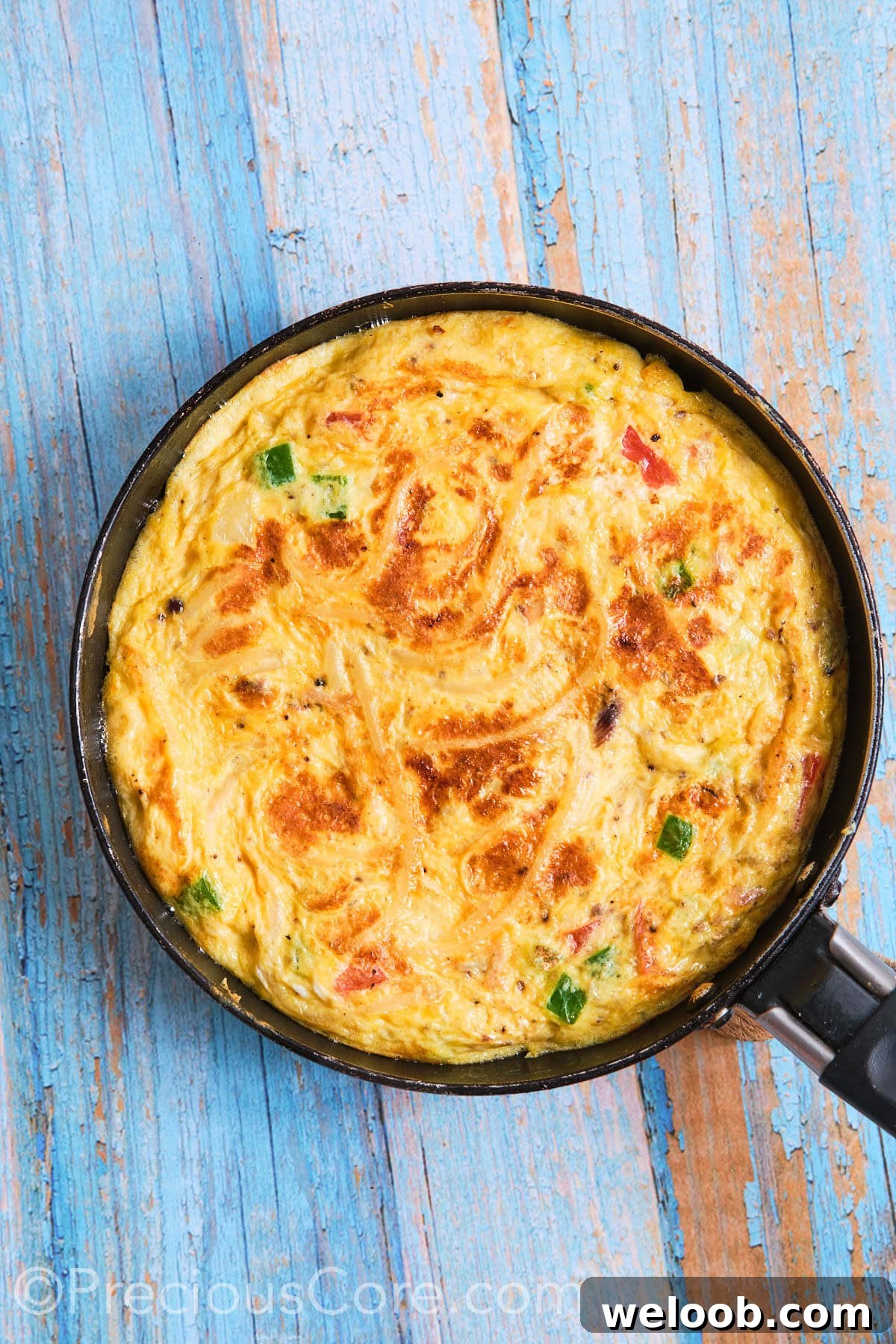 Omelette flipped in skillet.