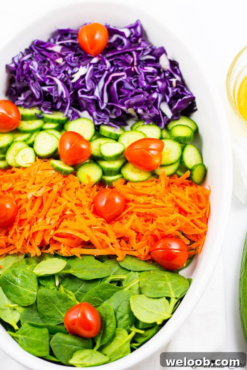 spinach cabbage salad with tomato hearts and honey lemon dressing