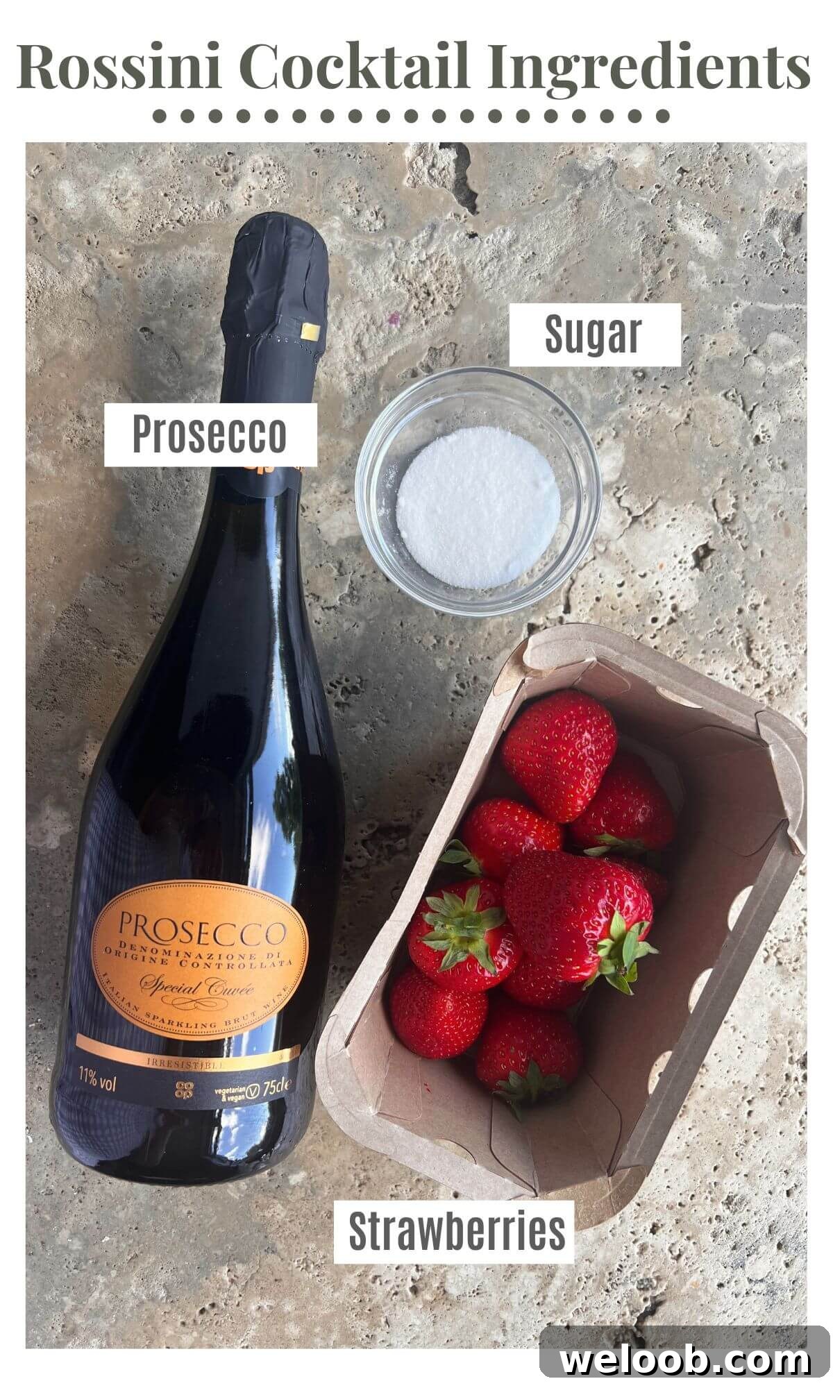 An overhead shot of a bottle of Prosecco, strawberries and sugar.