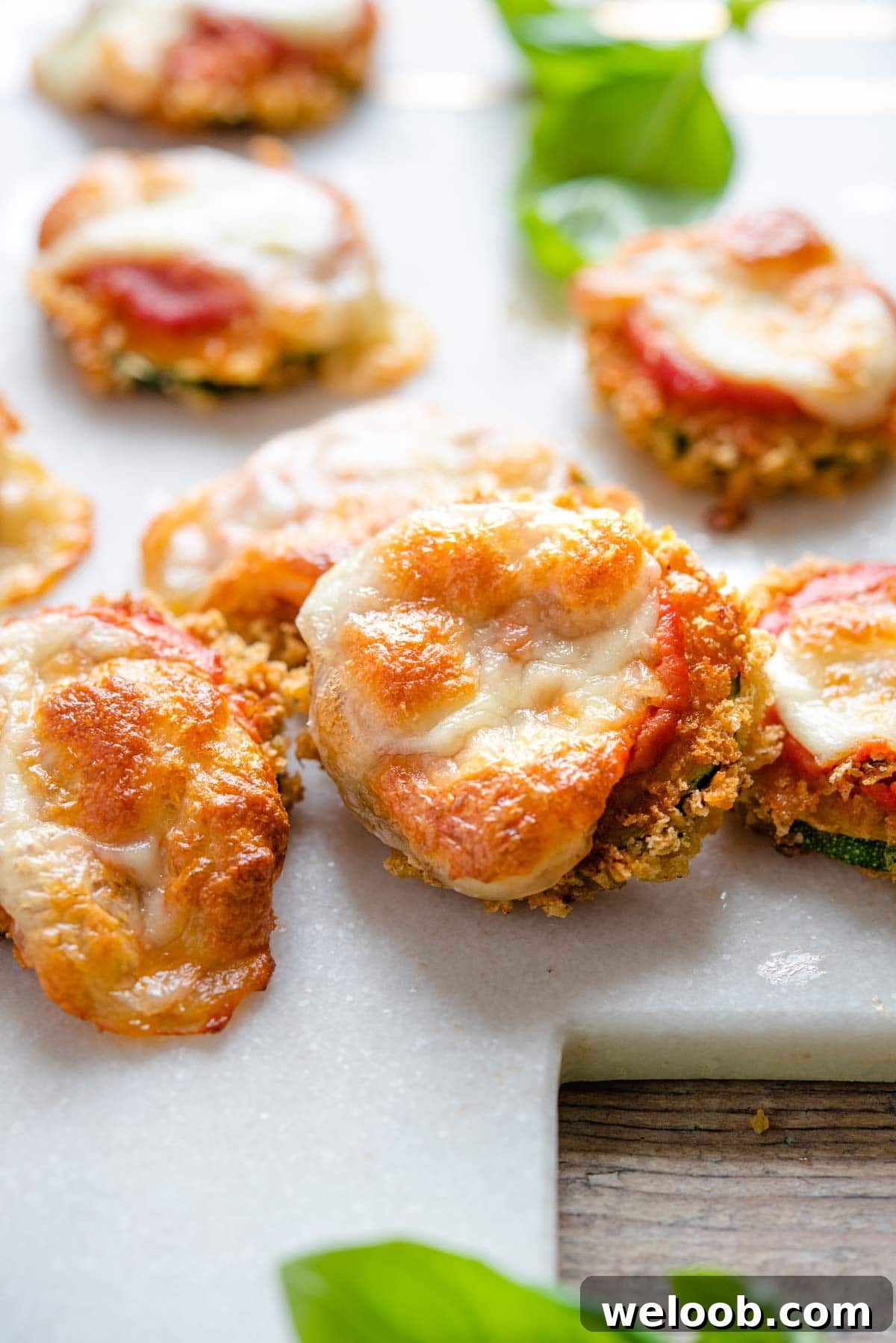 A close up of a zucchini pizza bite