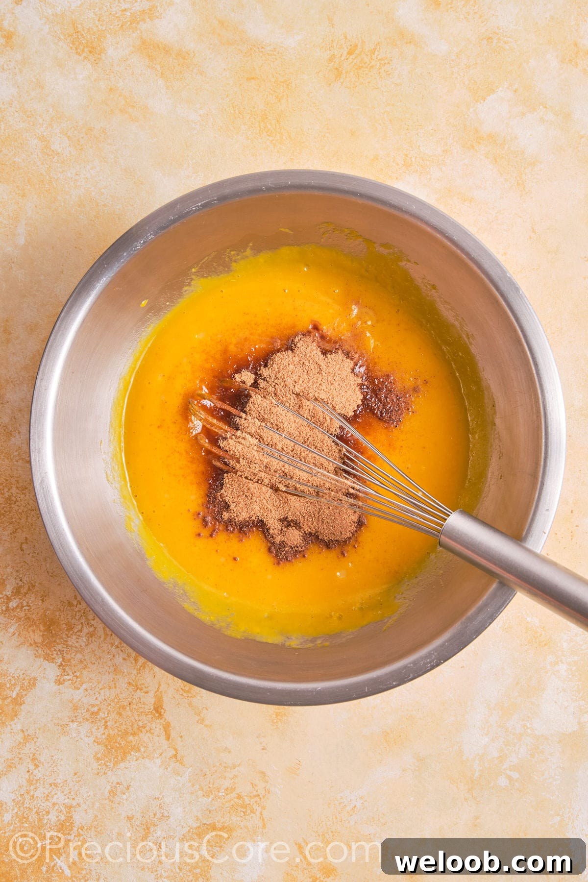 Brown sugar and other ingredients added to egg mixture.