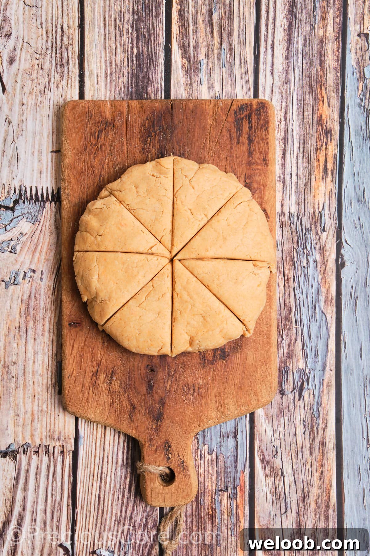 Buttery Sweet Potato Scones with Maple Glaze Recipe 11 Round shaped dough cut into 8 wedges.