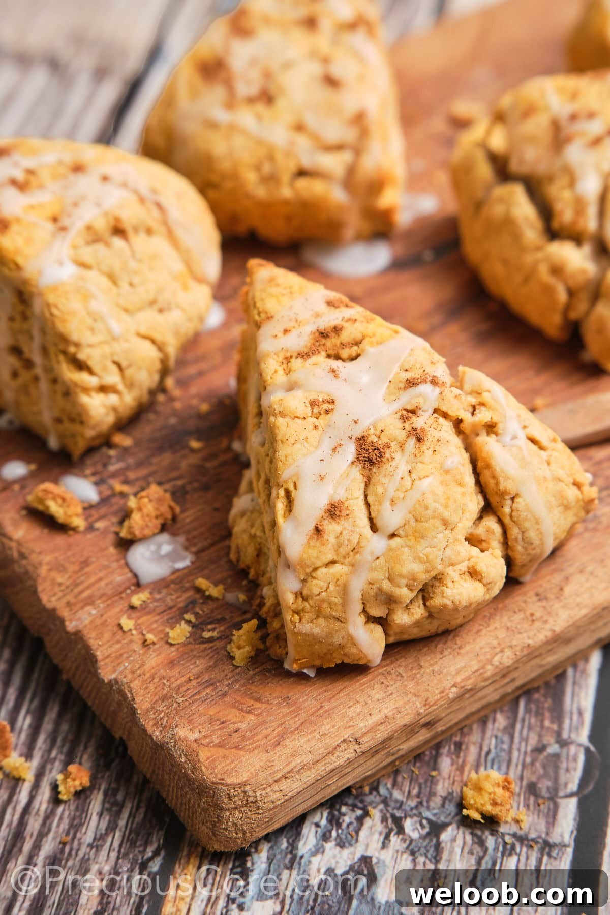 Buttery Sweet Potato Scones with Maple Glaze Recipe 4 Close up shot of a sweet potato scone.