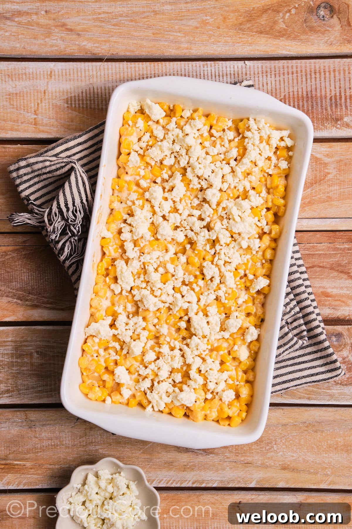 Corn topped with queso fresco.