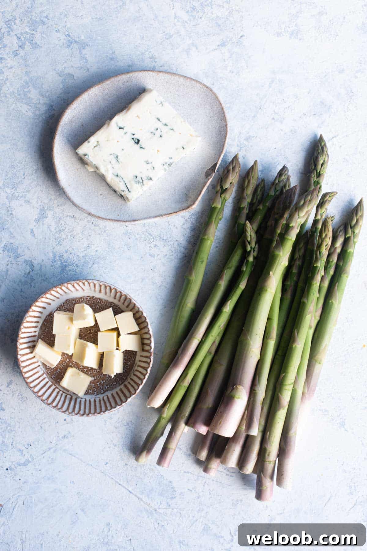 An overhead shot of all the ingredients needed to make our roasted asparagus with gorgonzola recipe.