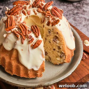 Butter pecan pound cake with a slice taken out.
