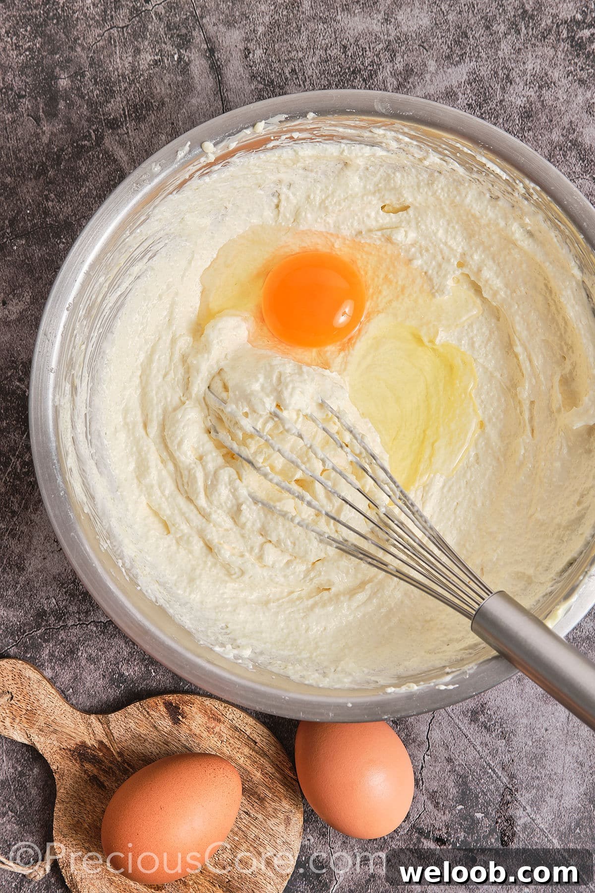 Add egg into the vessel and mix well