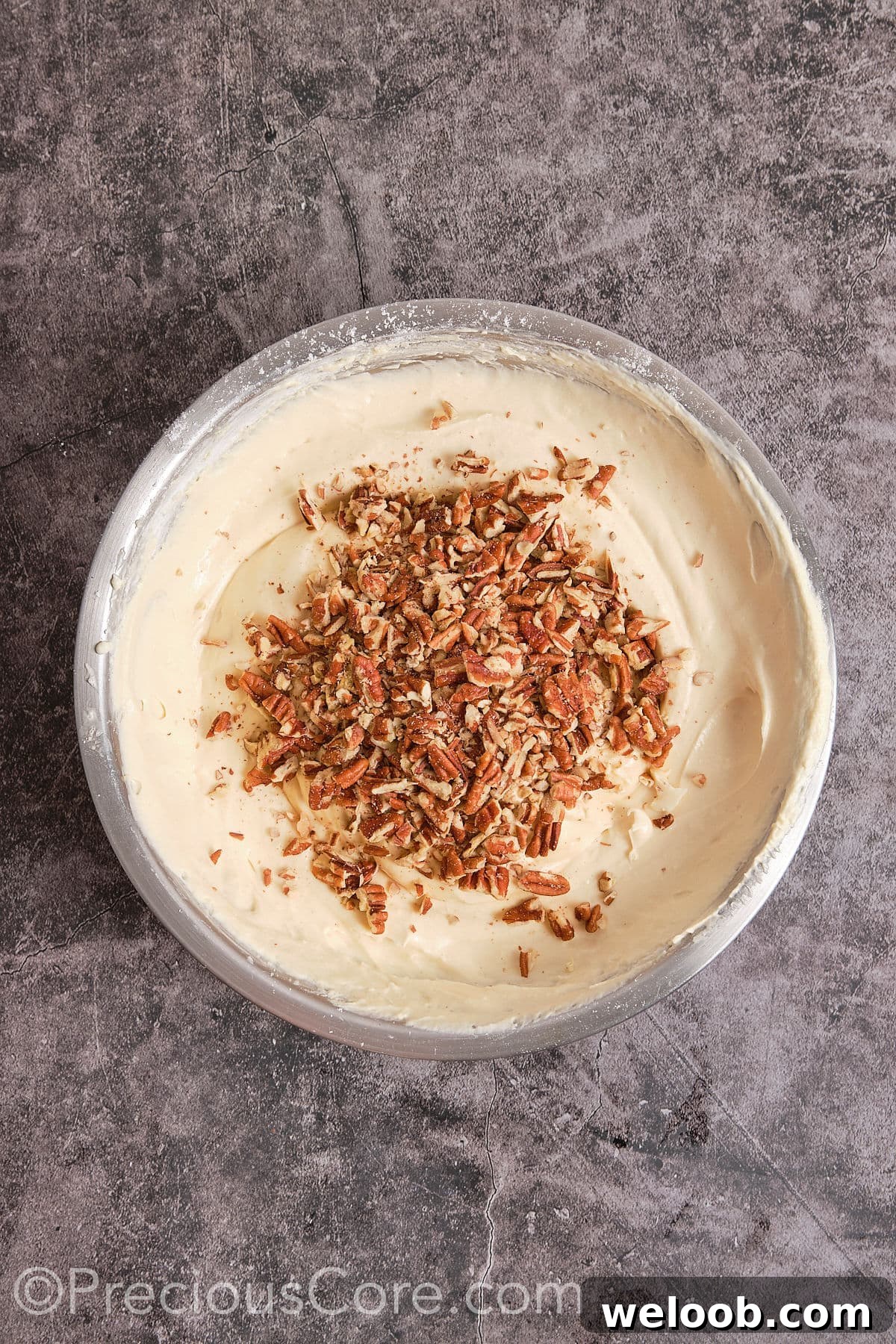 Add chopped peanuts to the mixture  and mix until it becomes smooth paste