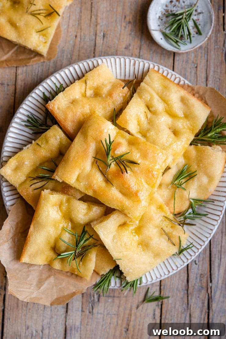 An overhead shot of rosemary focaccia on a plate