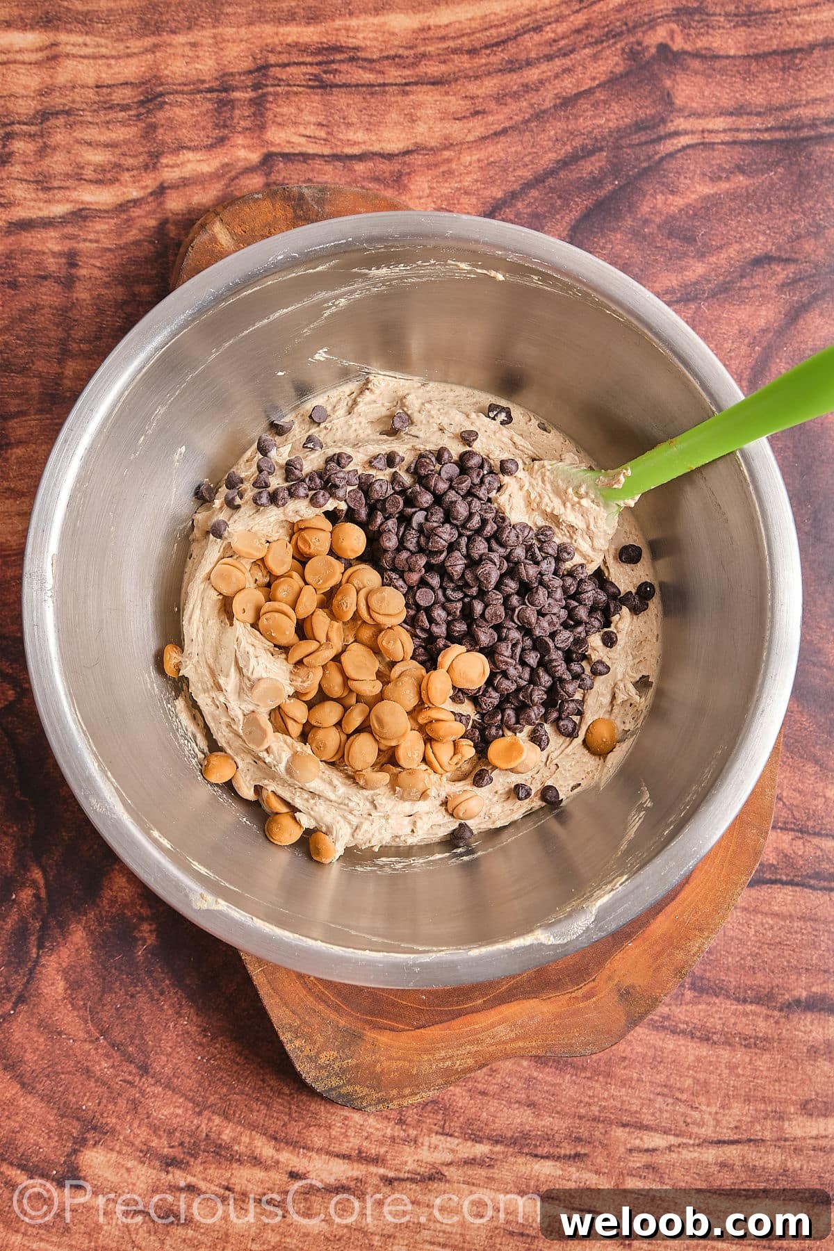 Add some chocolate chips and butterscotch chips to the mixture