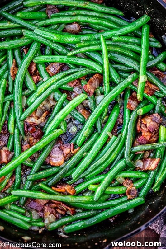 Pan of green beans with bacon.