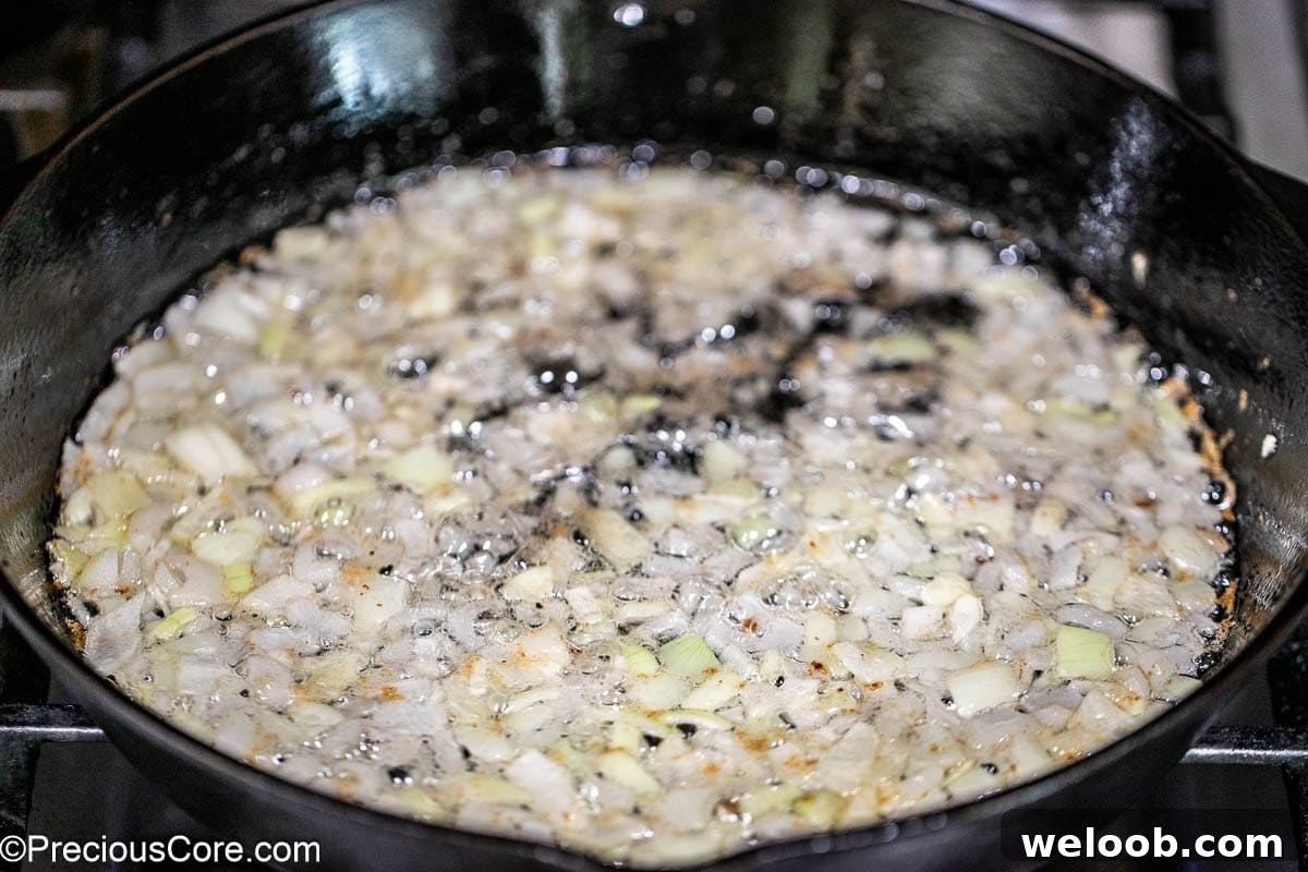 Onions sautéing in cast iron skillet.