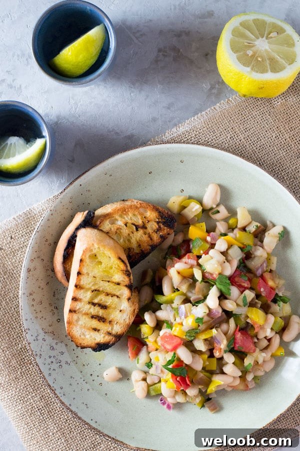 Warm easy bean salad with eggplant, tomato, garlic and fresh herbs. Insidetherustickitchen.com