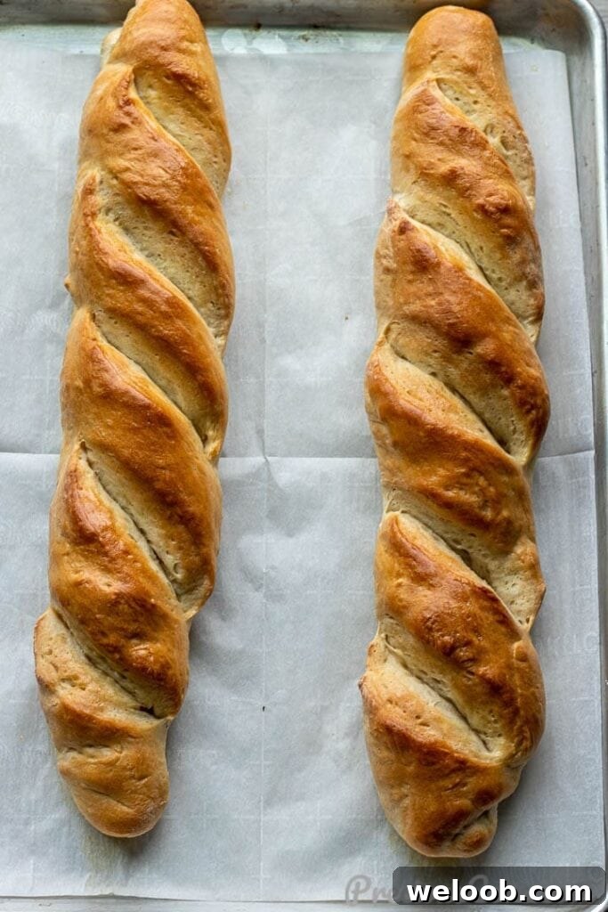 French bread loaves on large baking sheet