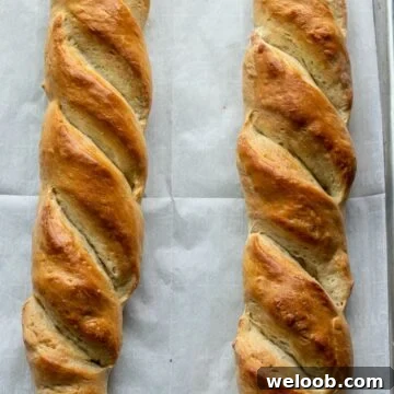 French bread loaves on large baking sheet