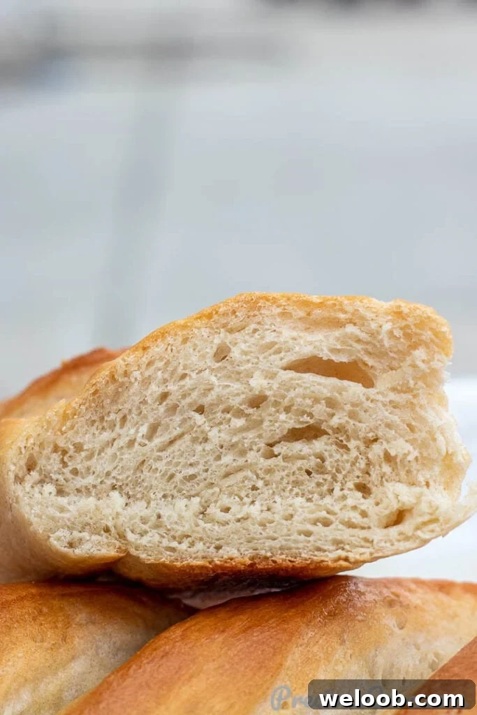 Cut loaf of French Bread showing airy texture