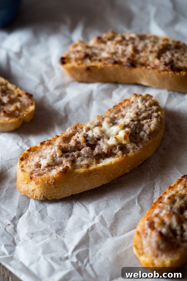 stracchino and sausage crostini inside the rustic kitchen