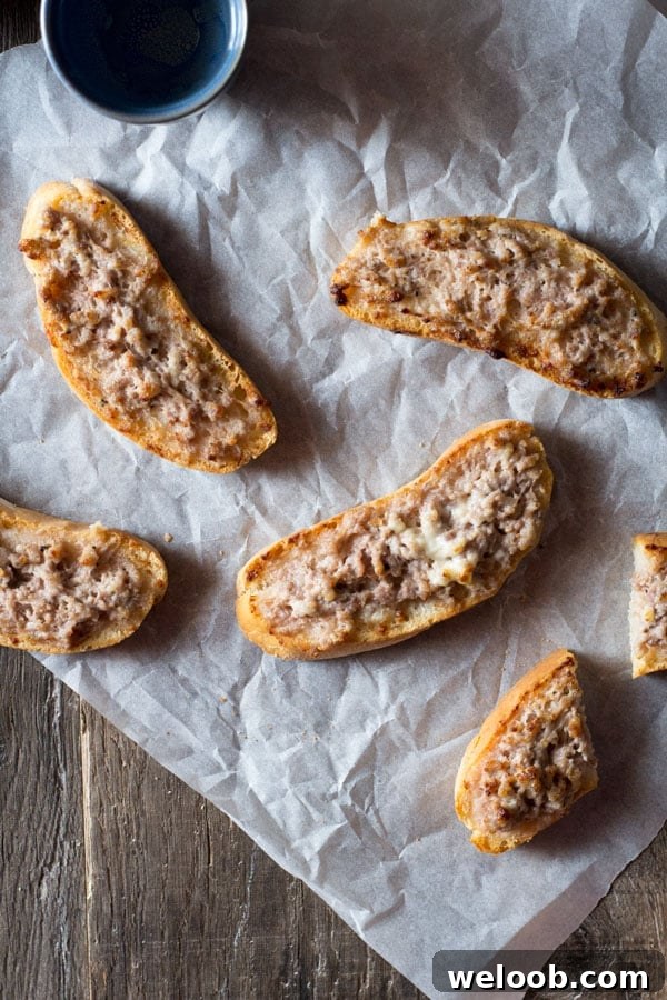 stracchino and sausage crostini inside the rustic kitchen