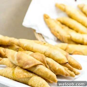 Plate and basket of Cameroonian fish rolls.