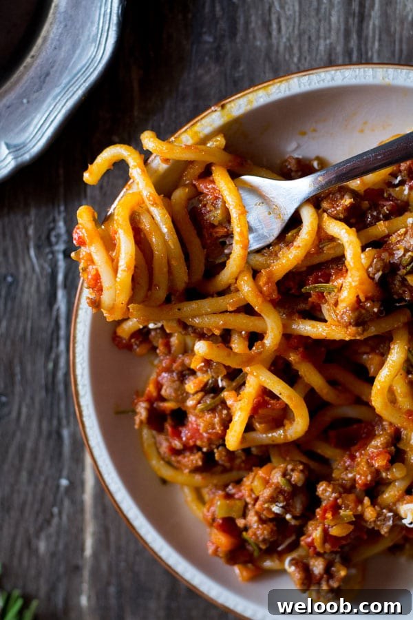 Pici-with-Tuscan-sausage-ragu-inside-the-rustic-kitchen