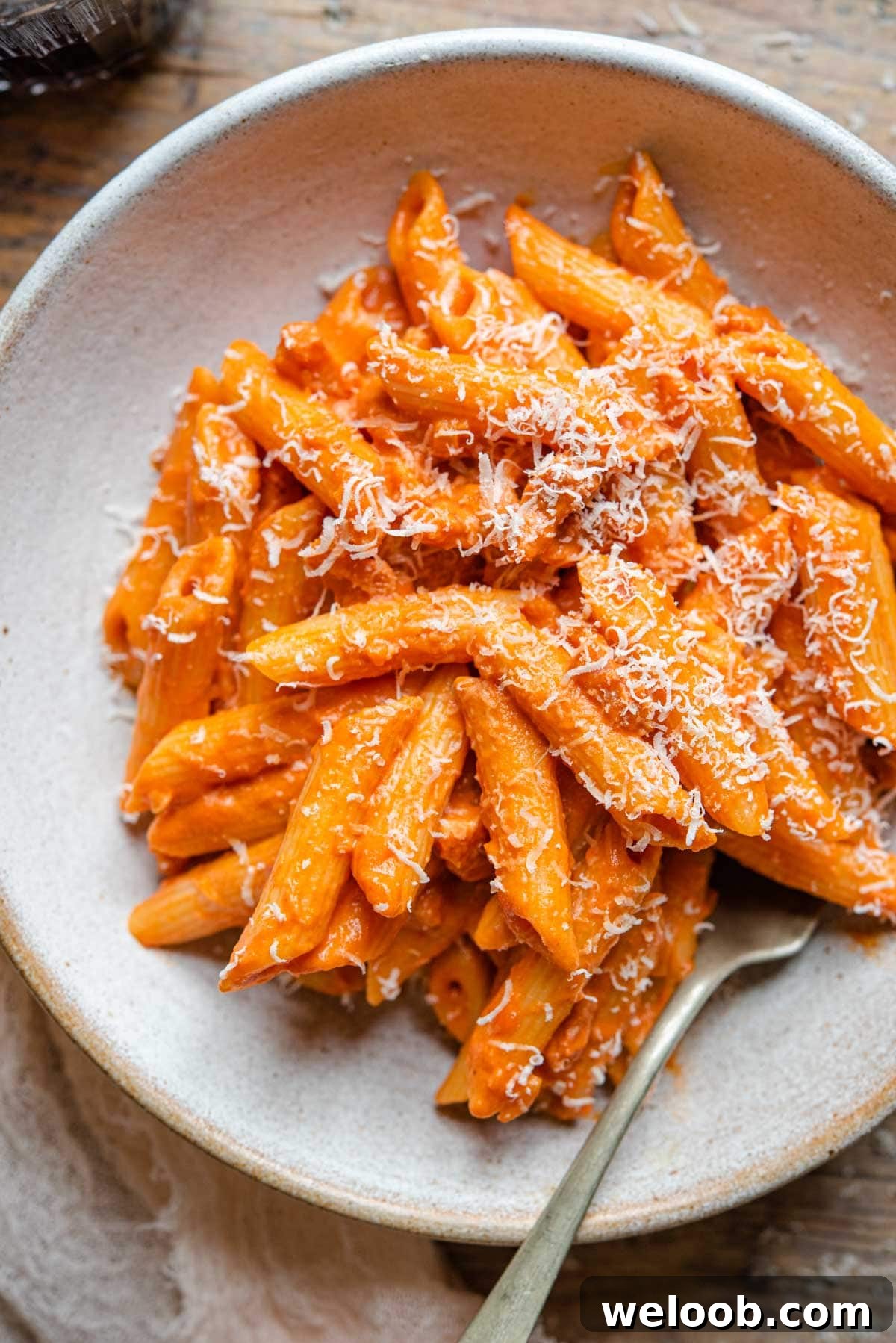 A close of penne alla vodka in a rustic bowl